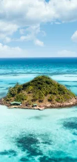 Tropical island with turquoise water under a blue sky.