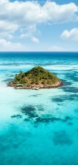 Tropical island surrounded by turquoise ocean and blue sky.