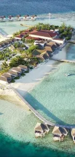 Aerial view of tropical island with overwater bungalows and blue ocean.