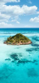 Tropical island surrounded by turquoise sea and blue sky.