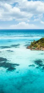 Aerial view of a tropical island surrounded by vibrant blue ocean waters.