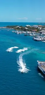 A vibrant tropical ocean dock with boats and clear blue water.