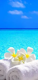 Tropical ocean with white flowers and blue sky.