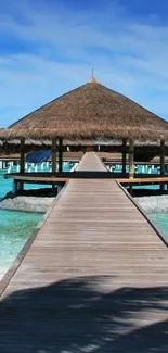 Overwater bungalow with turquoise waters and a clear blue sky.