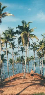 Tropical beach with palm trees and ocean backdrop on a sunny day.