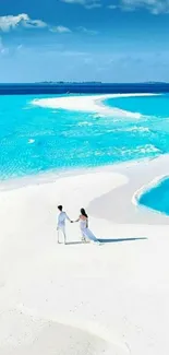 Couple walking on a serene tropical beach with blue waters.