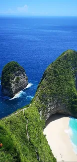 Stunning beach view with green cliffs and blue ocean.