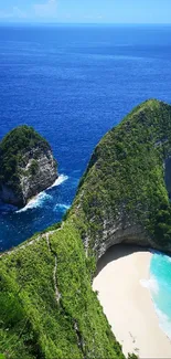 Stunning tropical beach with blue ocean and lush green cliffs.