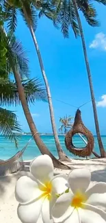 Scenic tropical beach with flowers, palm trees, and hammock.