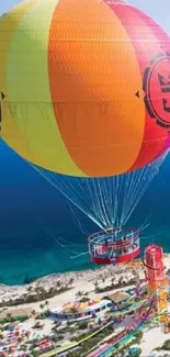 Colorful hot air balloon over tropical beach and ocean view.