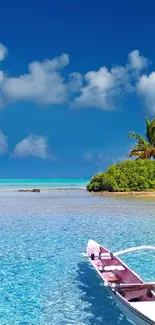 Tropical beach with clear waters, boat, and blue sky.