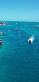 Tropical ocean view with boats and turquoise waters.