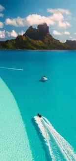 A stunning turquoise ocean view with boats and a distant tropical island.