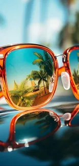 Sunglasses reflecting a tropical beach scene with palms.