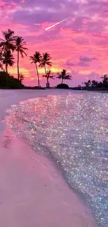 A tropical sunset beach with a vibrant pink sky and shimmering water.