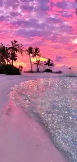 Tropical beach at sunset with pink sky and palm trees.