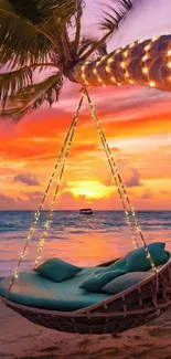 Hammock on a tropical beach with a stunning sunset background.