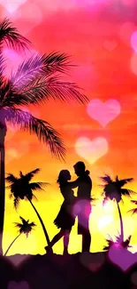 Romantic silhouette of a couple at sunset with palm trees.