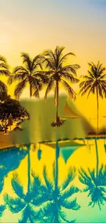 Vibrant sunset with palm trees reflected in a serene pool.