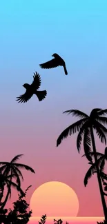 Tropical sunset with palm trees and birds in silhouette on a colorful sky.