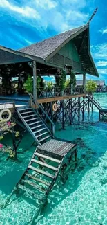 Tropical house over turquoise waters with vibrant sky.