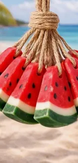 Watermelon-shaped soaps hanging on a beach.