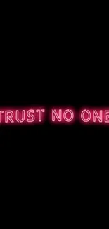 Neon sign reading 'Trust No One' on black background.