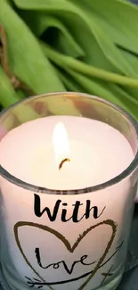 Romantic setup with tulips and a candle on a quilted surface.