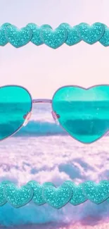 Turquoise heart sunglasses with ocean background and glitter hearts.