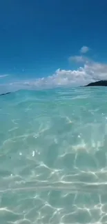 Turquoise ocean with clear waters and blue sky.