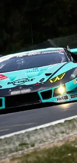 Turquoise race car speeding on a track under a cloudy sky.