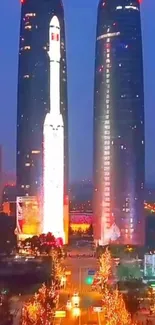 Illuminated twin towers in nighttime cityscape.