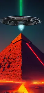 UFO flying over illuminated red pyramid at night.