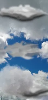 UFO-shaped clouds in a blue sky background.