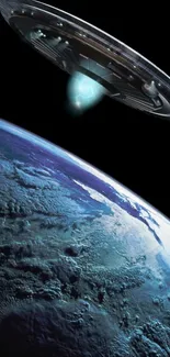 UFO hovering over Earth's surface in space wallpaper.