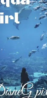 Aquarium wallpaper with fish and a girl gazing toward the underwater world.