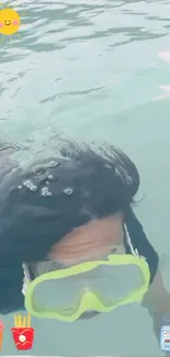 Person snorkeling underwater with clear blue water and graphics.