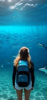 Diver surrounded by sharks in a vivid blue underwater scene.