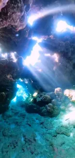 Sunbeams illuminate an underwater cave scene.