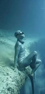 An underwater freediver rests peacefully on a sea ledge.