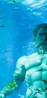 Underwater Poseidon statue in a blue ocean scene.