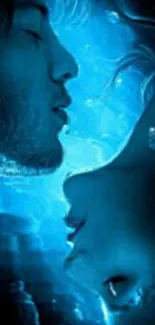 Romantic couple underwater in blue hues.