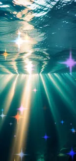 Sunlight beams through ocean water creating a stunning underwater scene.