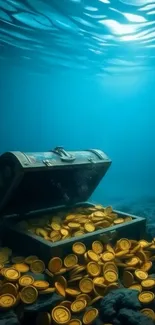 Underwater treasure chest with golden coins on ocean floor.