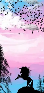 Unicorn silhouette under pink and blue sky with bird flock.