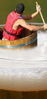 Man paddling a wooden barrel on foam.