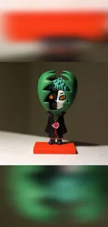 Green and orange figurine in striking mobile wallpaper.