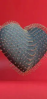 Heart-shaped pin cushion on red background.