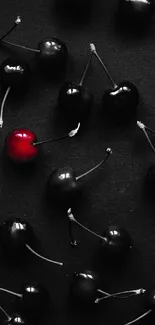 Mobile wallpaper with black cherries and one standout red cherry.