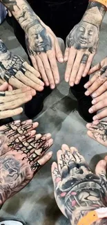 Circle of tattooed hands with artistic designs in a unique wallpaper.